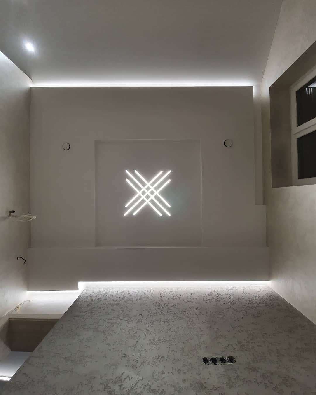 Accent wall with X shaped LED fixture, earlier work