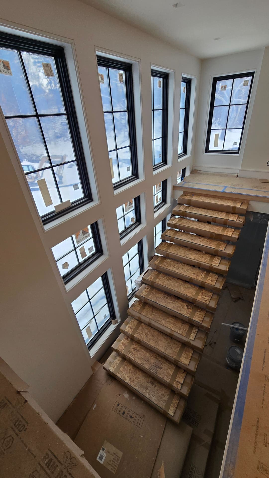 New black grid windows trimmed during an interior renovation