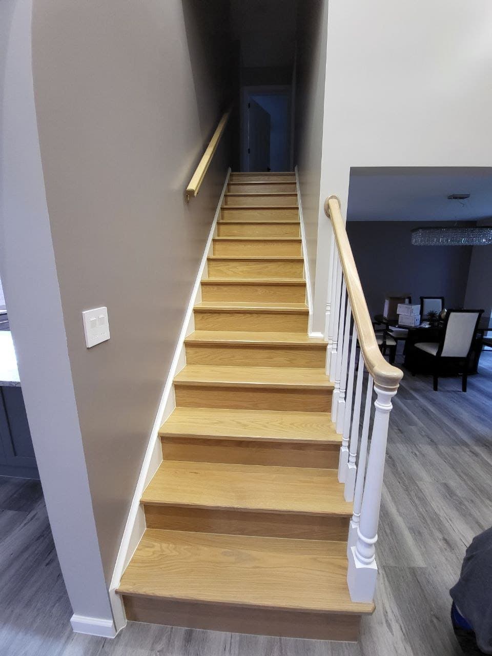 Rebuilt oak staircase with white balusters and curved handrail