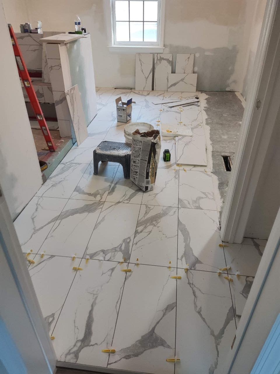 Porcelain floor tile laid with a leveling spacer system